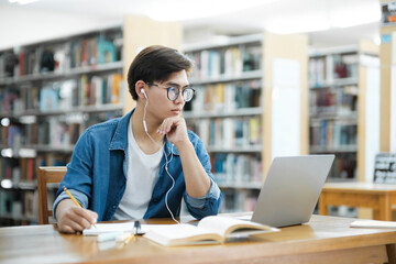Student studying at library.