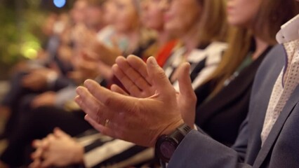 Man applauds at a business event