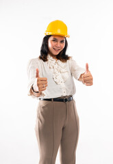 a beautiful architect with hardhat standing with thumbs up at isolated background