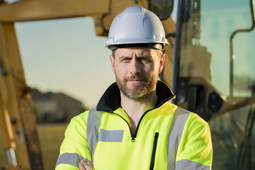 Worker with bulldozer on site construction. Man excavator worker. Construction driver worker with...