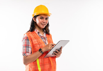 a female architect in savety waistcoat using the digital tablet on isolated background