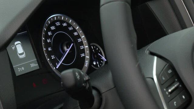 Car dashboard with speedometer, tachometer, clock, fuel tank gauge, oil temperature and display with on-board computer and black odometer with white arrows and divisions. Auto service industry.