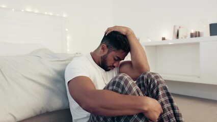 Depression, anxiety and stress with man in bedroom for frustrated, problem and lonely. Grief, sad and mental health issues with guy suffering at home and feeling failure, struggle and burnout