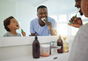 Dental, brushing teeth and father with son in bathroom for bonding, morning routine and cleaning. Teaching, self care and toothbrush with black man and child at home for wellness, fresh and hygiene