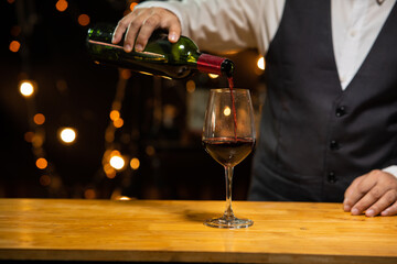 Barman pouring whiskey whiskey glass beautiful night