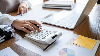 Business Professional Chartered Accountant Woman working with computer and calculator Sales Invoice Accounting