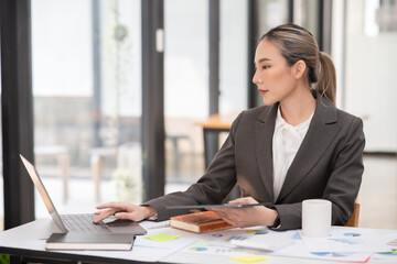 Asian business woman lawyer Working on paperwork at the office