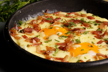 fried eggs in a frying pan