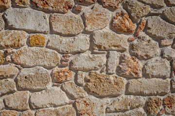 close up of the walls made of stone , stone background.