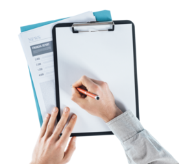 Businessman writing down notes on a clipboard