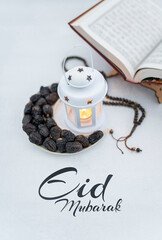Iftar background dates arranged in shape of crescent moon with traditional white lantern lamp