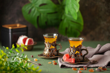Black tea in Turkish glasses armudu. Eastern Tea Ceremony.