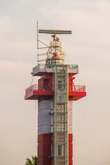 Radar tower in the port and lighthouse