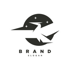 Negative space flying phoenix with star on circle background logo design