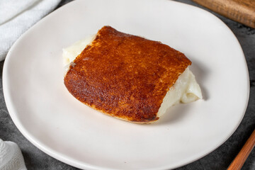 Milky dessert or Kazandibi. Traditional Turkish cuisine desserts. Kazandibi on a dark background. Close up