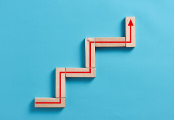 Business growth, success, development or improvement concepts. Wooden blocks stacking as step stair...