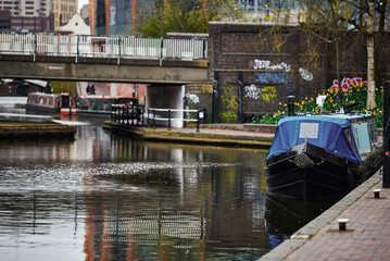 Colorful boats, houses on the water in the canals of Birmingham