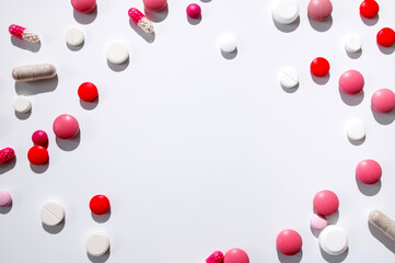Assorted of colorful tablets, capsules, pills, vitamins on white background. Medicine drug concept, minimalist mockup. Pharmaceutical health care background Flat lay top view copy space