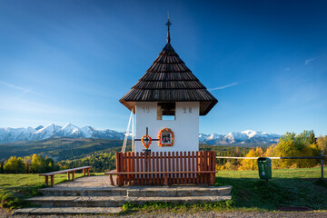 Landscape with a chapel and snow-covered Tatra Mountains in Lapszanka, Łapszanka, Malopolskie, Poland © Leszek Szelest