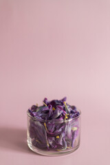 Purple dried tulip petals in glass jar