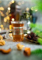Traditional Arabic Ramadan setup for tea, Islamic concept Ramadan and Eid Mubarak type image, Turkish Tea with Bokeh Light Background