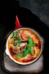 Baked eggplant with tomatoes, mozzarella cheese, basil and parmesan. Italian dish, Sicilian cuisine - Parmigiana di melanzane, top view