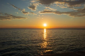 Foto auf Glas sunset orange and golden sea background © Martina Simonazzi