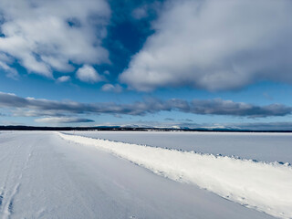 Fototapeta na wymiar Winter landscape of ice road in north Sweden