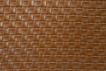 Brown braided leather texture. Brown texture for background.