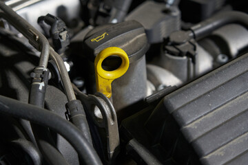 engine oil filler and oil dipstick. mechanisms under the hood of the car. car repair