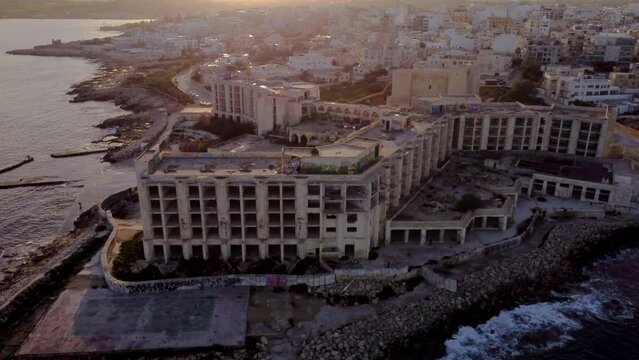 Drone shot landscape view of Jerma Palace Hotel in Marsaskala, sunset time, Malta
