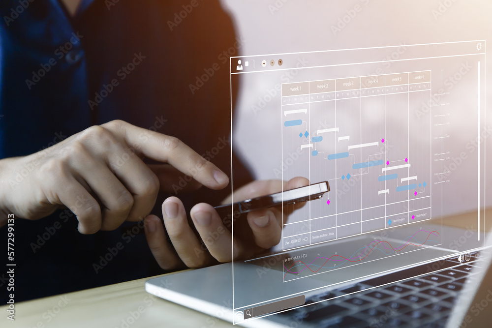 Poster male manager managing business planning project schedule in the office. gantt chart showing on virtu