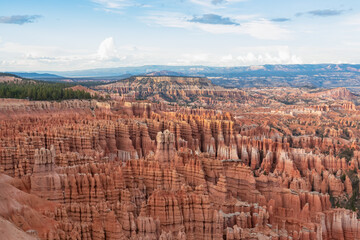 Panoramic aerial view of massive hoodoo sandstone rock formations in Bryce Canyon National Park, Utah, USA. Natural unique amphitheatre sculpted from the reddest rock of the Claron Formation. Awe