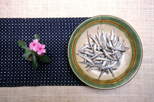 A plate of kibinago fish served in a longevity food restaurant.