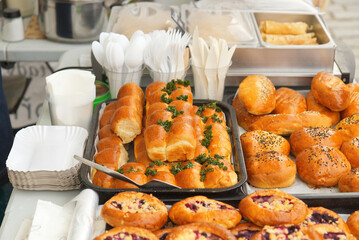 Stand with fresh sweet and savoury pastries on display at the Náplavka Farmers' Market in winter at the beginning of the new season