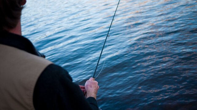 A young man in his early thirties  fly fishing near Durango, Colorado.