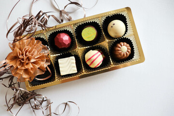 set of chocolates and gift box on white background