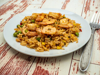 fried rice with  shrimps on white plate