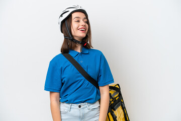 Young Ukrainian woman with thermal backpack isolated on white background laughing in lateral position