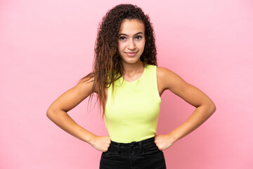 Young hispanic woman isolated on pink background angry