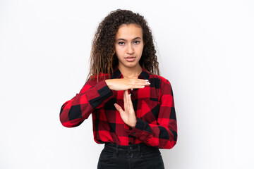 Young Arab woman isolated on white background making time out gesture