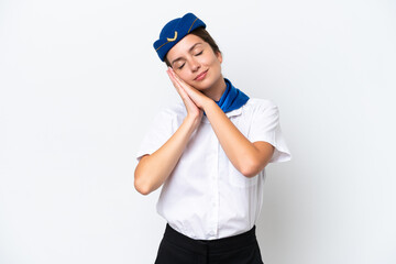 Airplane stewardess caucasian woman isolated on white background making sleep gesture in dorable expression