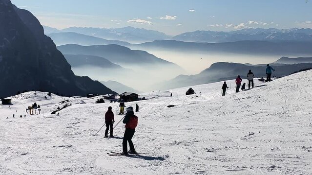 Skiing season footage in the Dolomites mountains in Italy on a beautiful sunny day
