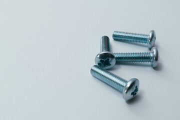 Steel screw. Screws on white background. Some metal machine screw bolts on white background.
