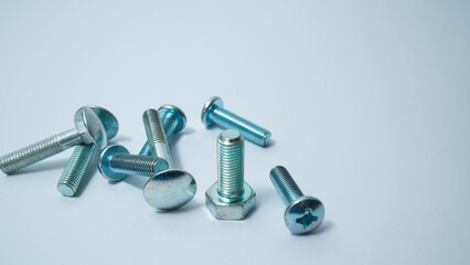 Set of bolts on a white background. Construction abstraction. Industrial background. Screws and...