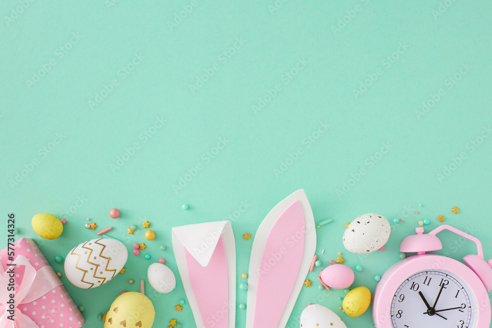 Wall mural easter concept. top view photo of easter bunny ears colorful eggs sprinkles gift box and pink alarm 