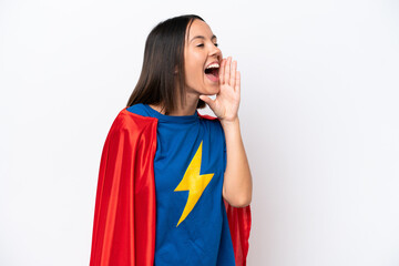 Super Hero caucasian woman isolated on white background shouting with mouth wide open to the lateral