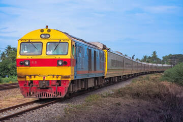 Fototapeta na wymiar Passenger train by diesel locomotive passed the railway curve. 