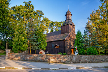 Wooden church of St. Marcin Bishop in Stara Wisniewka, Greater Poland Voivodeship, Poland - obrazy, fototapety, plakaty