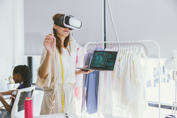 Costume designer using modern VR visual digital design technology in tailor studio